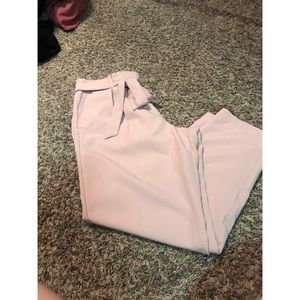 Mid-rise pink paper bag pants.
